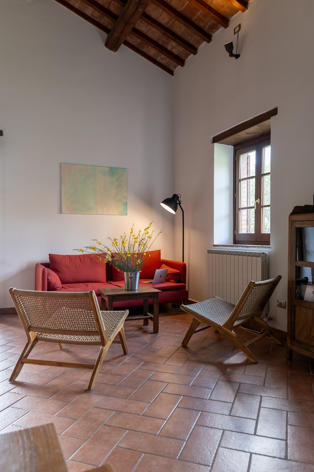 Armchairs and reading lamp in the living area of the villa