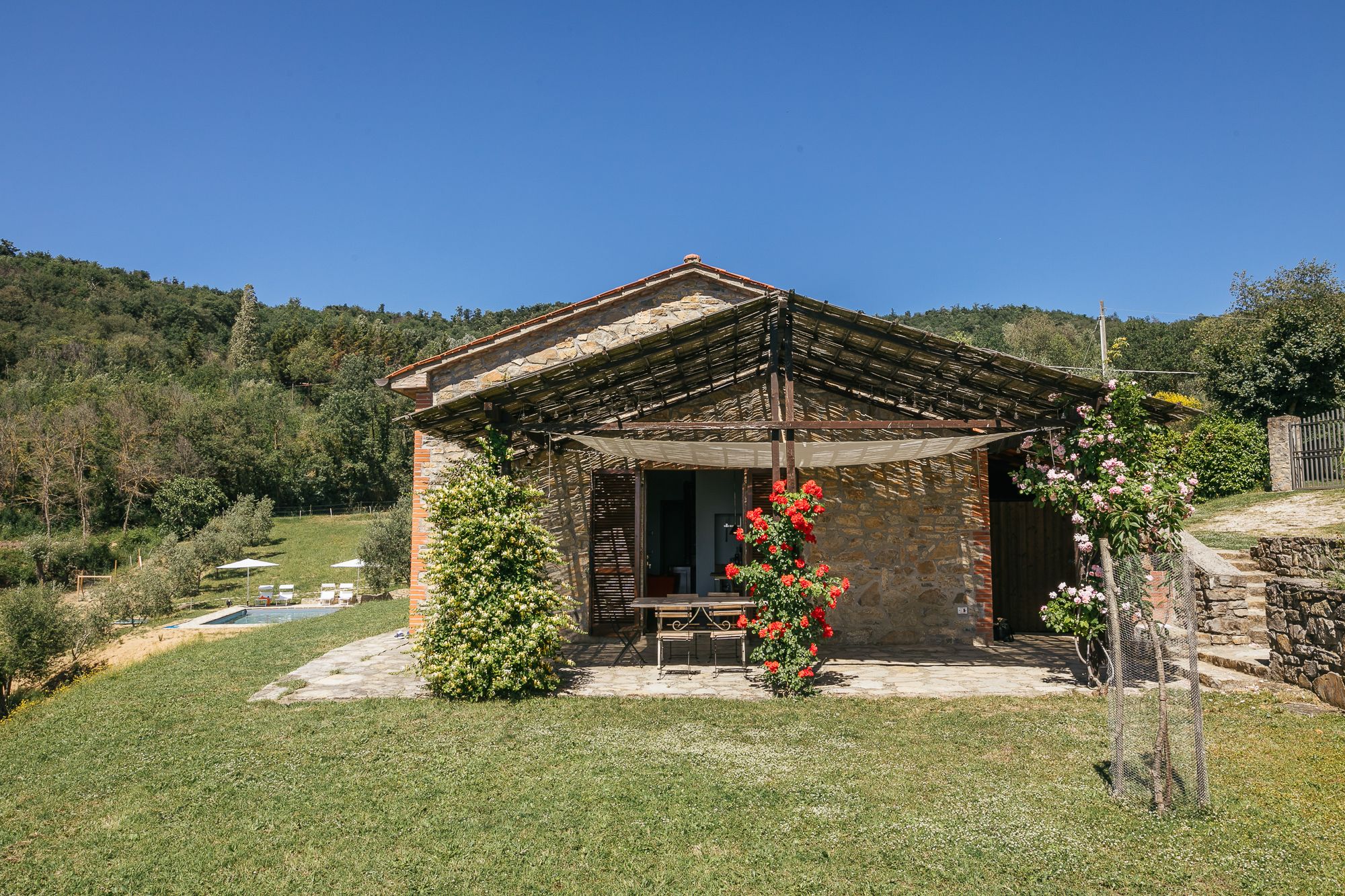 The house at Casa Campori in the Umbrian countryside, roses by the door