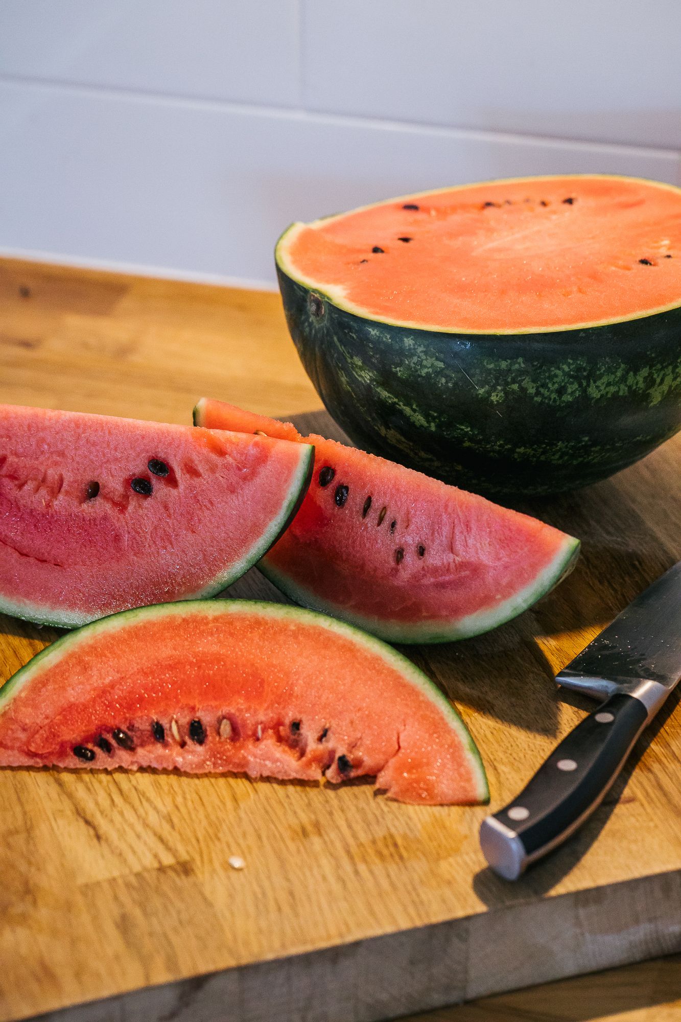 Watermelon cut on the kitchen table in high summer